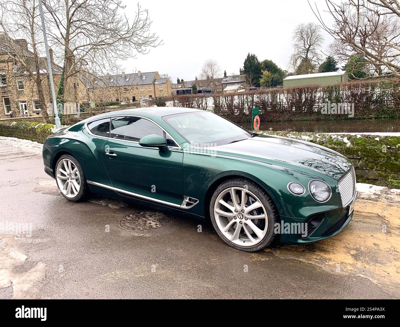 Bentley Continental car view green posh vehicle outside wet rain Snow shinny elegant style fresh looking looks  saloon cosy desirable two door wheels - Smartphone Captured Stock Image