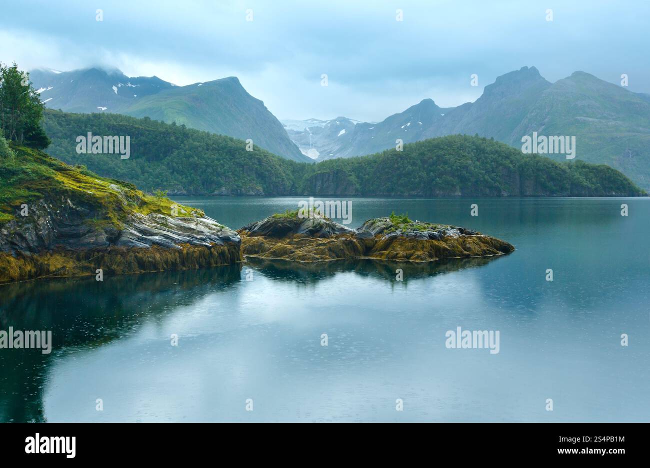 Lake (fjord) and rainy view to Svartisen Glacier (Norway) Stock Photo