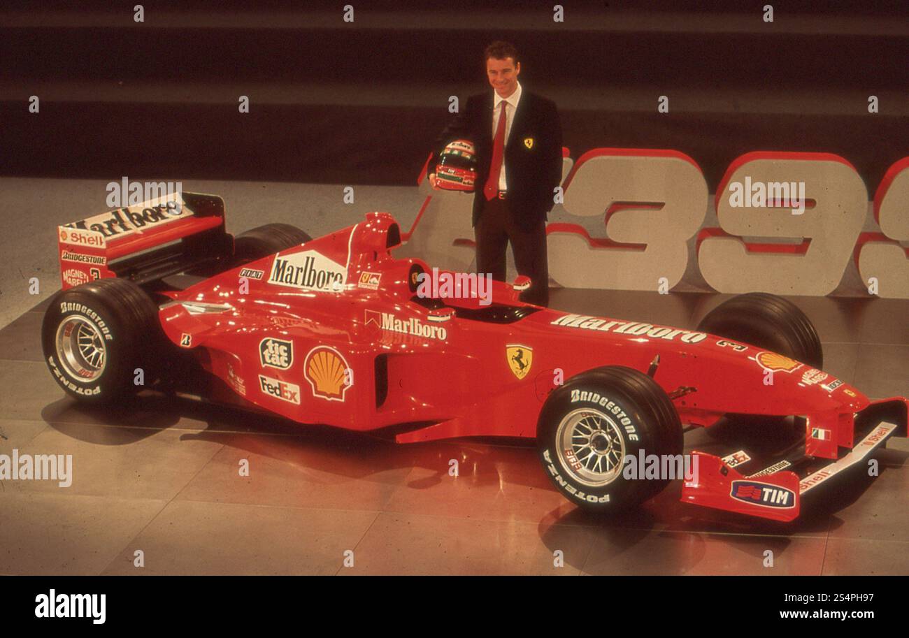 British motorsports racing driver Eddie Irvine and Ferrari F399 Formula ...