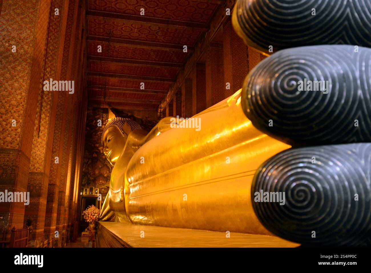 the reclining buddha in the temple of Wat Pho in the city of Bangkok in ...