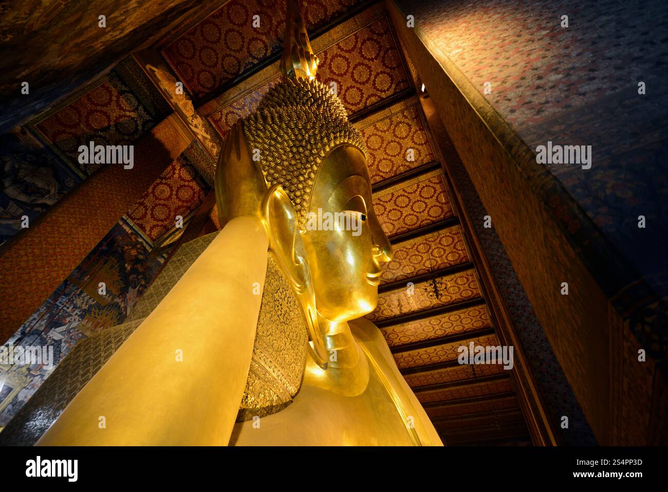 the reclining buddha in the temple of Wat Pho in the city of Bangkok in ...