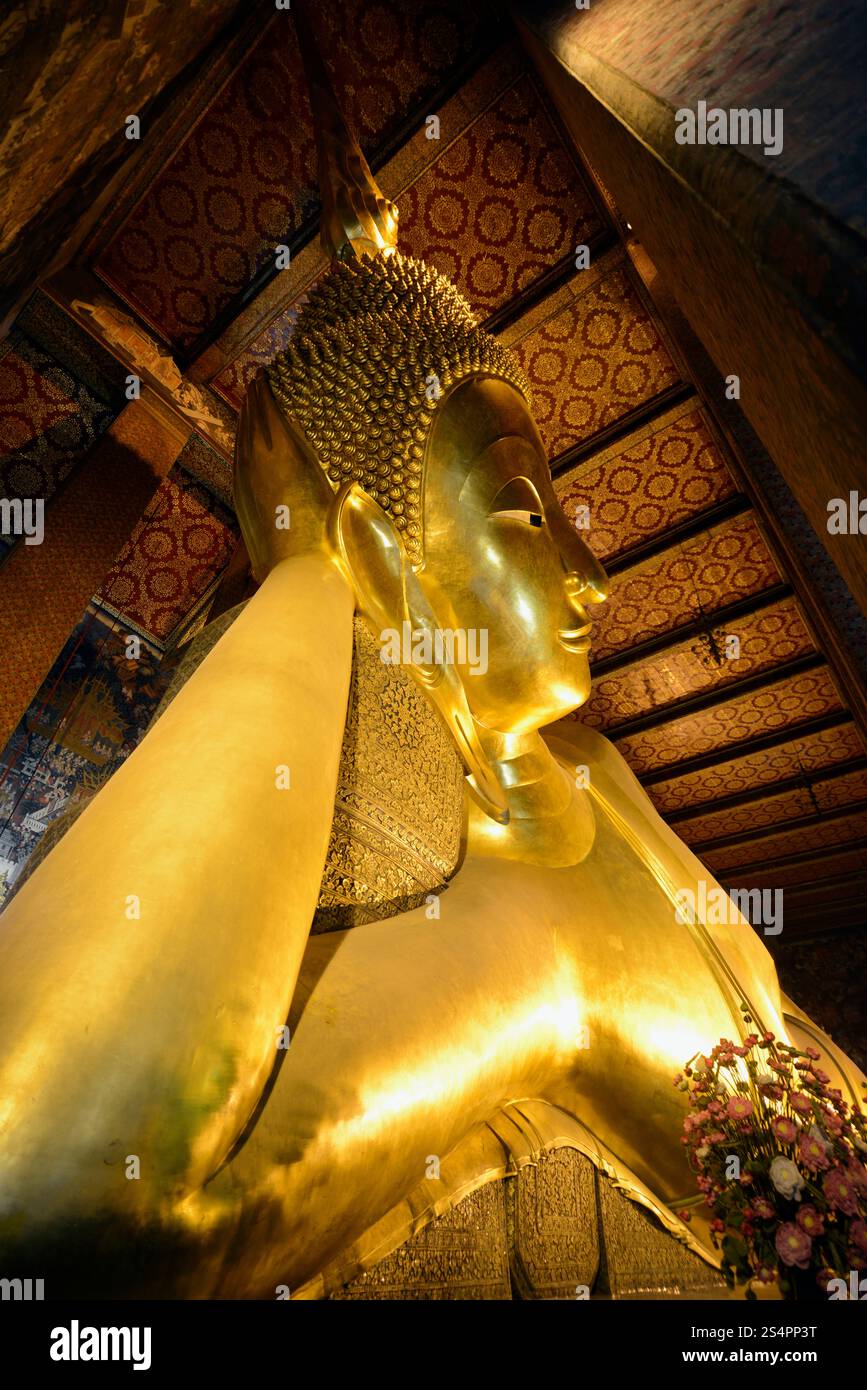 the reclining buddha in the temple of Wat Pho in the city of Bangkok in ...