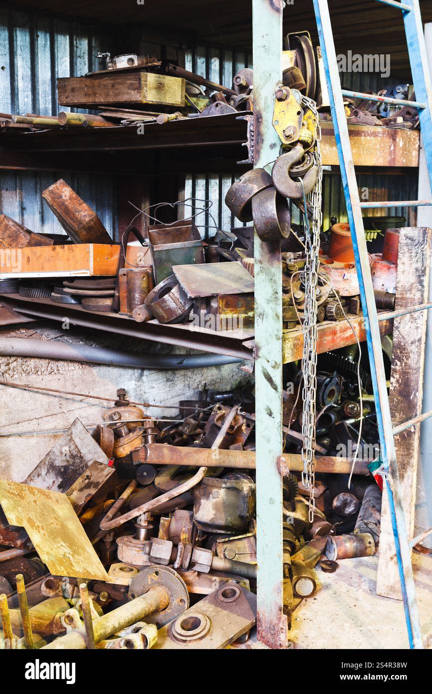 factory warehouse with used spare parts in mechanical workshop Stock ...