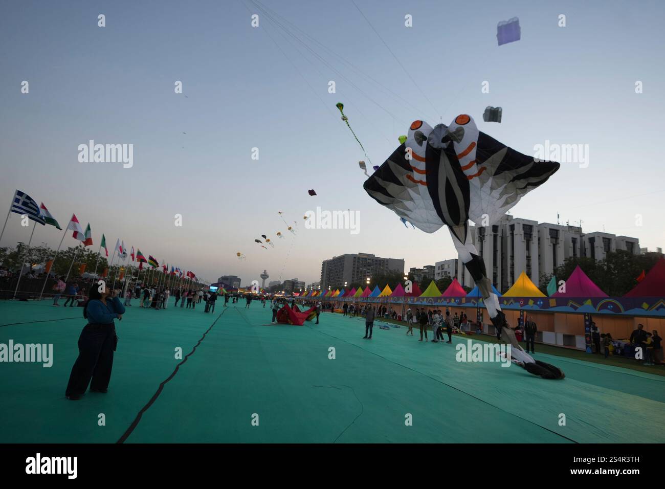 Kites fly during an International kite festival in Ahmedabad, India