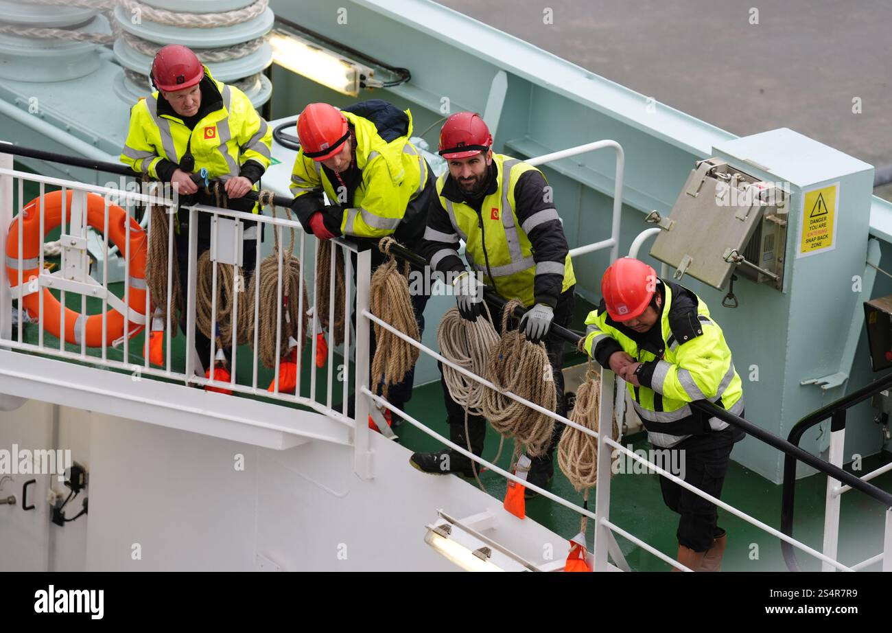 Workers on board The Glen Sannox ferry after arriving in Brodick on