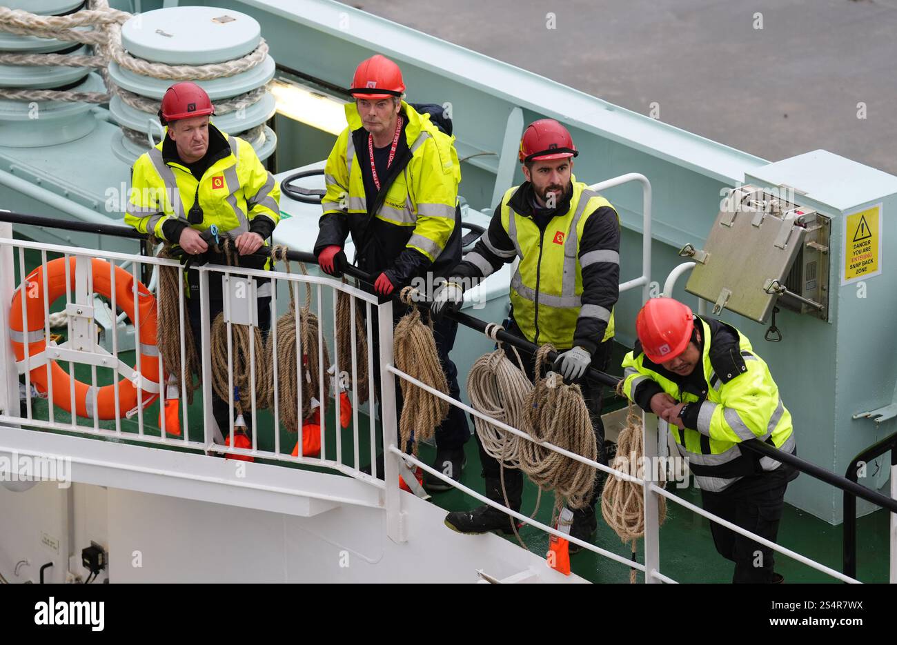 Workers on board The Glen Sannox ferry after arriving in Brodick on