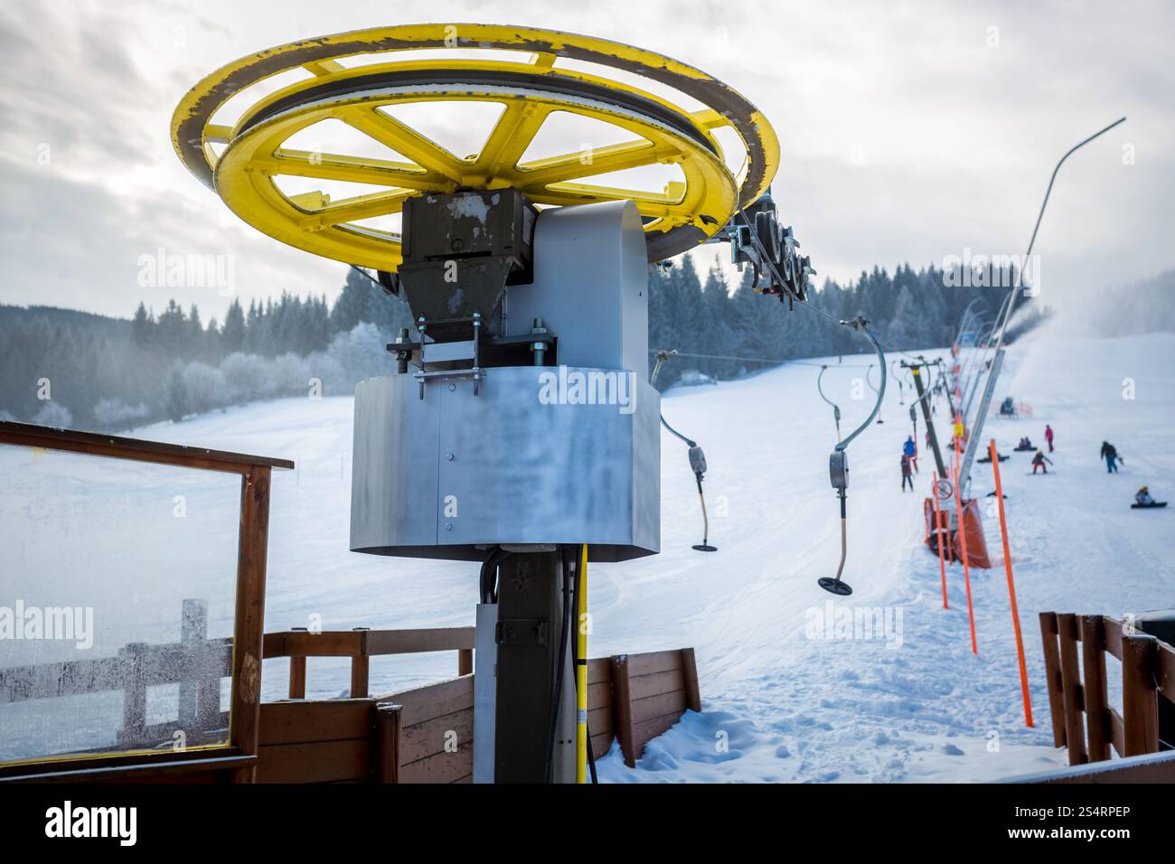 Rotating ski lifts mechanism on foot of high mountain at Alps Stock Photo