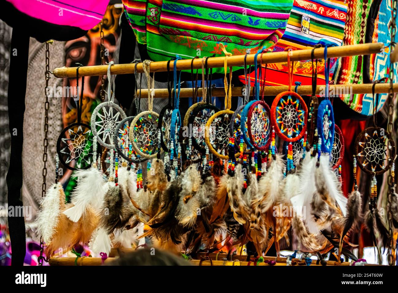 Feira da Ladra, Lisbon's flea market at Campo de Santa Clara, showcases vibrant dreamcatchers and colourful fabrics celebrating culture and art. Stock Photo