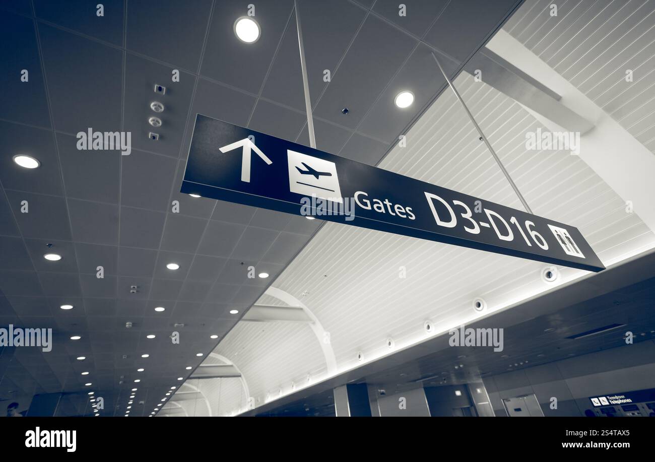Closeup toned shot of gate sign in airport terminal Stock Photo - Alamy