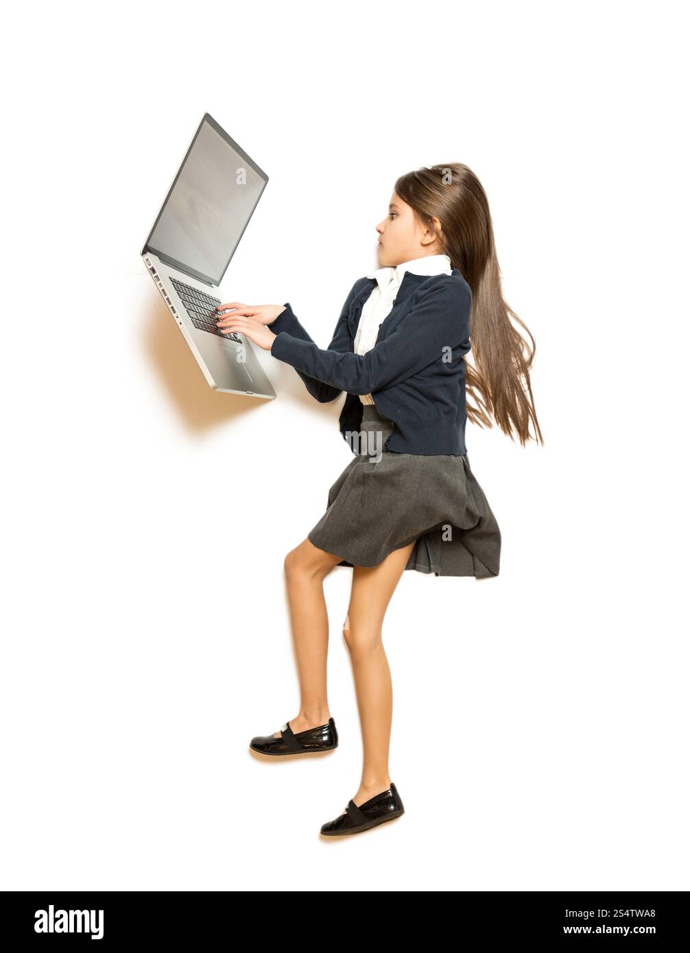 Isolated photo of cute girl lying on floor and using laptop Stock Photo ...