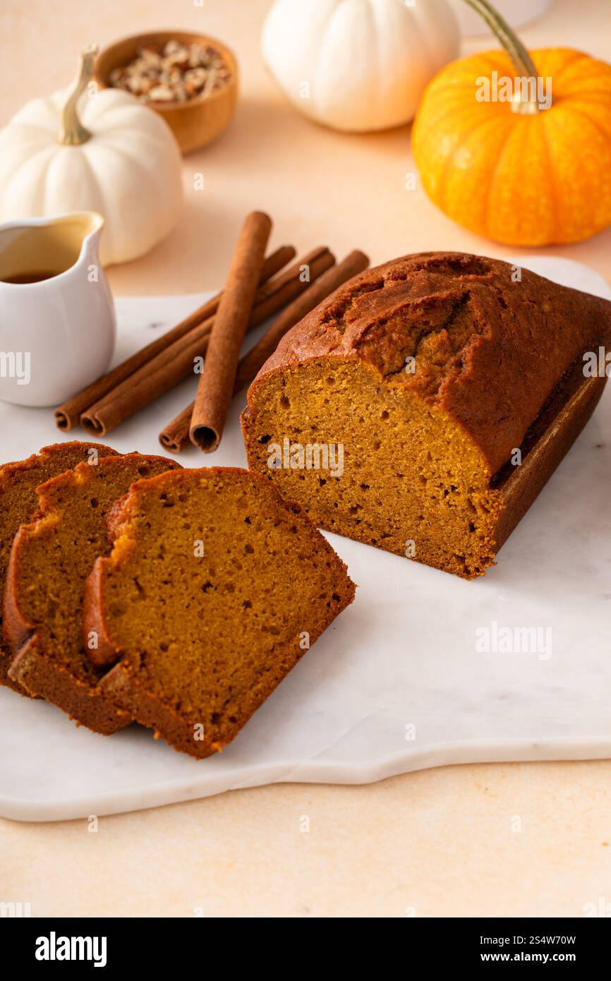 Pumpkin bread freshly baked sliced on a serving board, Thanksgiving dessert idea Stock Photo
