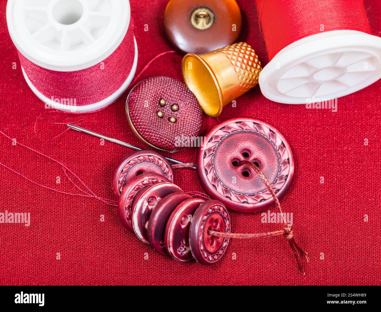 dressmaking still life - top view of bobbins with sewing thread ...
