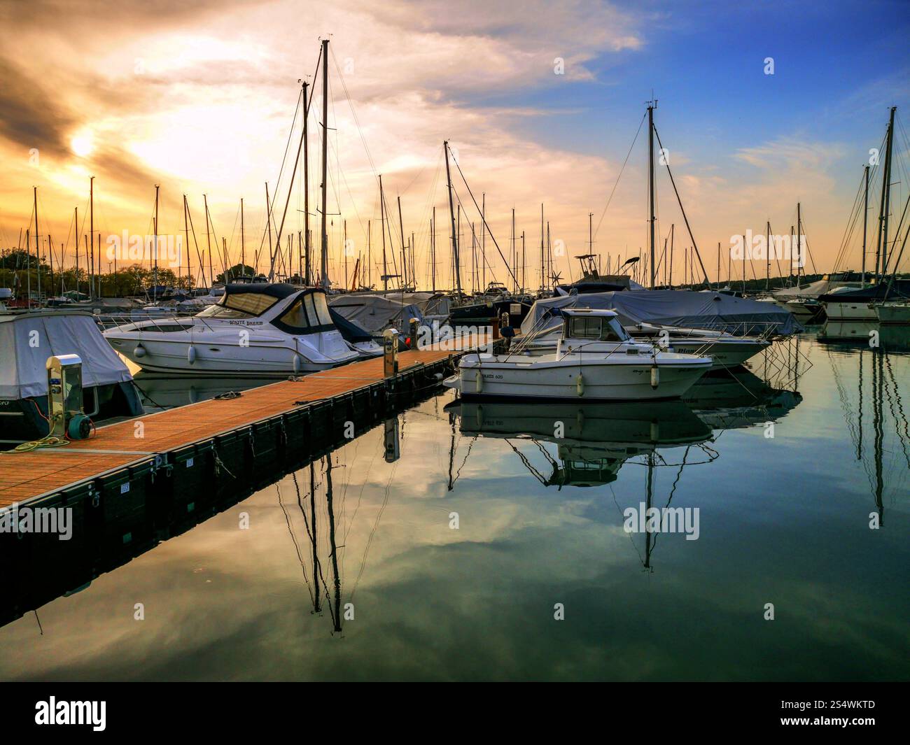 Boats at Sunset in a Marina Stock Photo