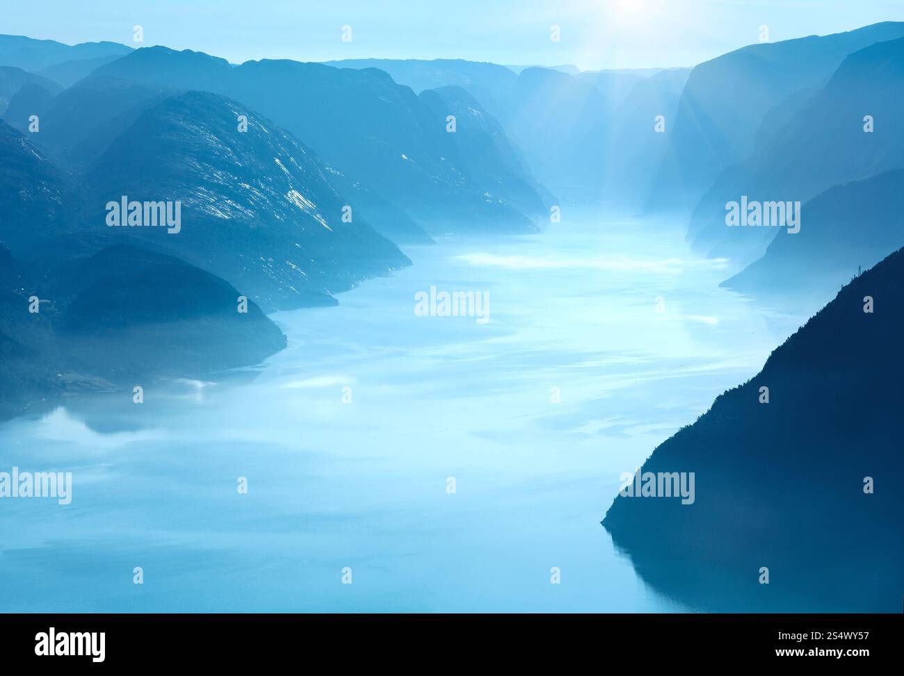 Summer morning misty view from Preikestolen massive cliff top (Norway, Lysefjorden) Stock Photo