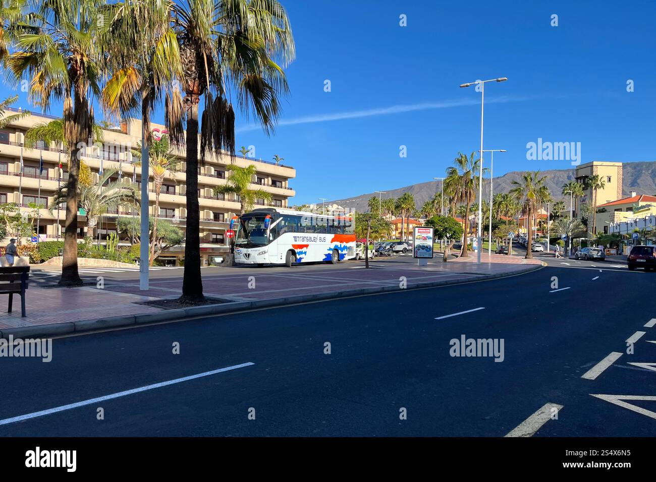 Across the street from the GF Fanabe Hotel, where a Transalex Bus is parked outside. Costa Adeje, Tenerife, Canary Islands, Spain. 11th January 2025. - Smartphone Captured Stock Image