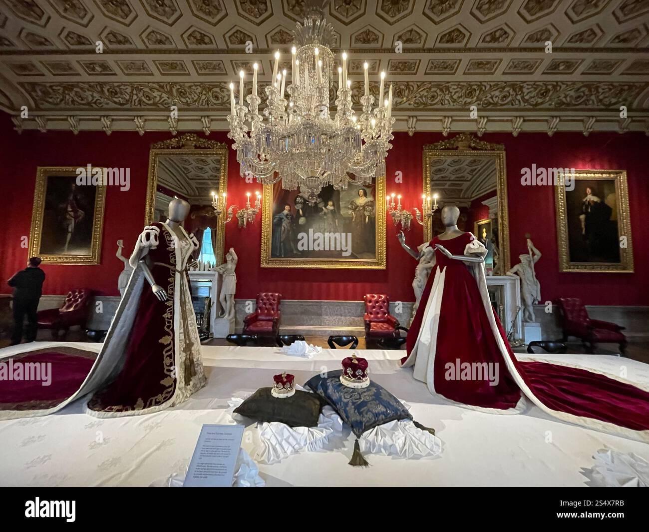 Crowns and Royal gowns on display in The Great Dining Room at Chatsworth House - Smartphone Captured Stock Image