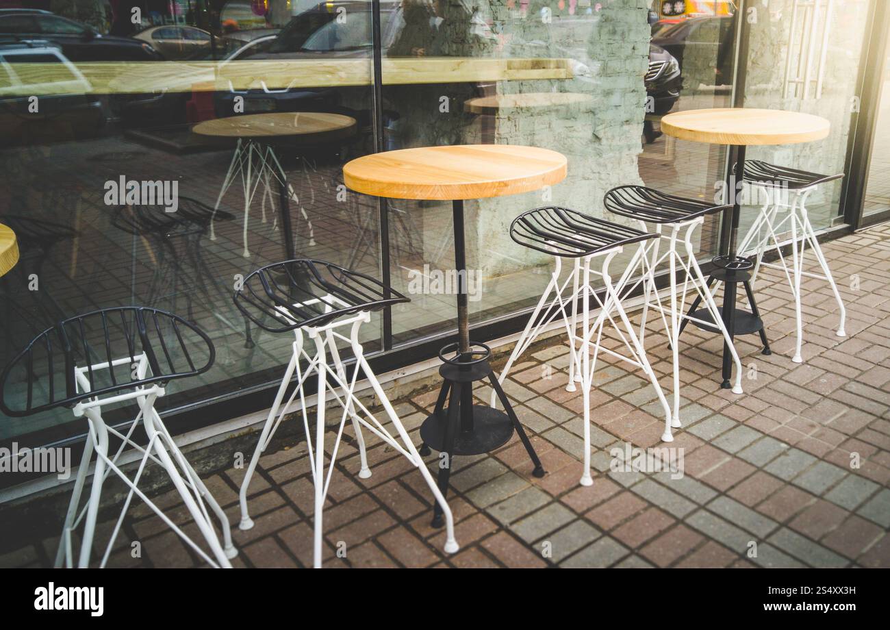 Toned photo of outdoor cafe with metal chairs and tables Stock Photo ...
