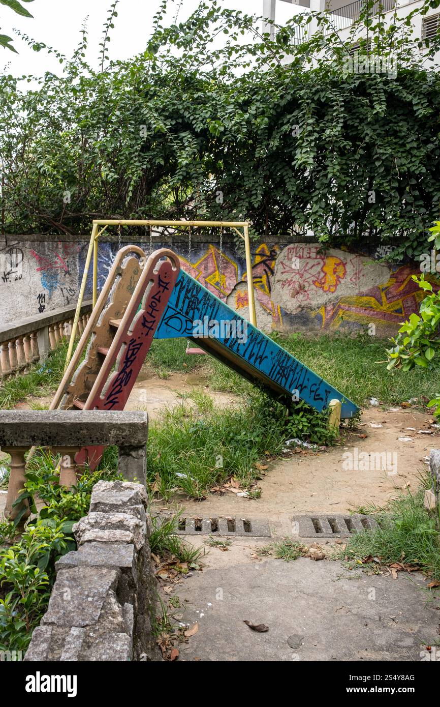 A Graffitied Slide in an empty Playground in the Santa Teresa District of Rio De Janeiro, Brazil. Stock Photo