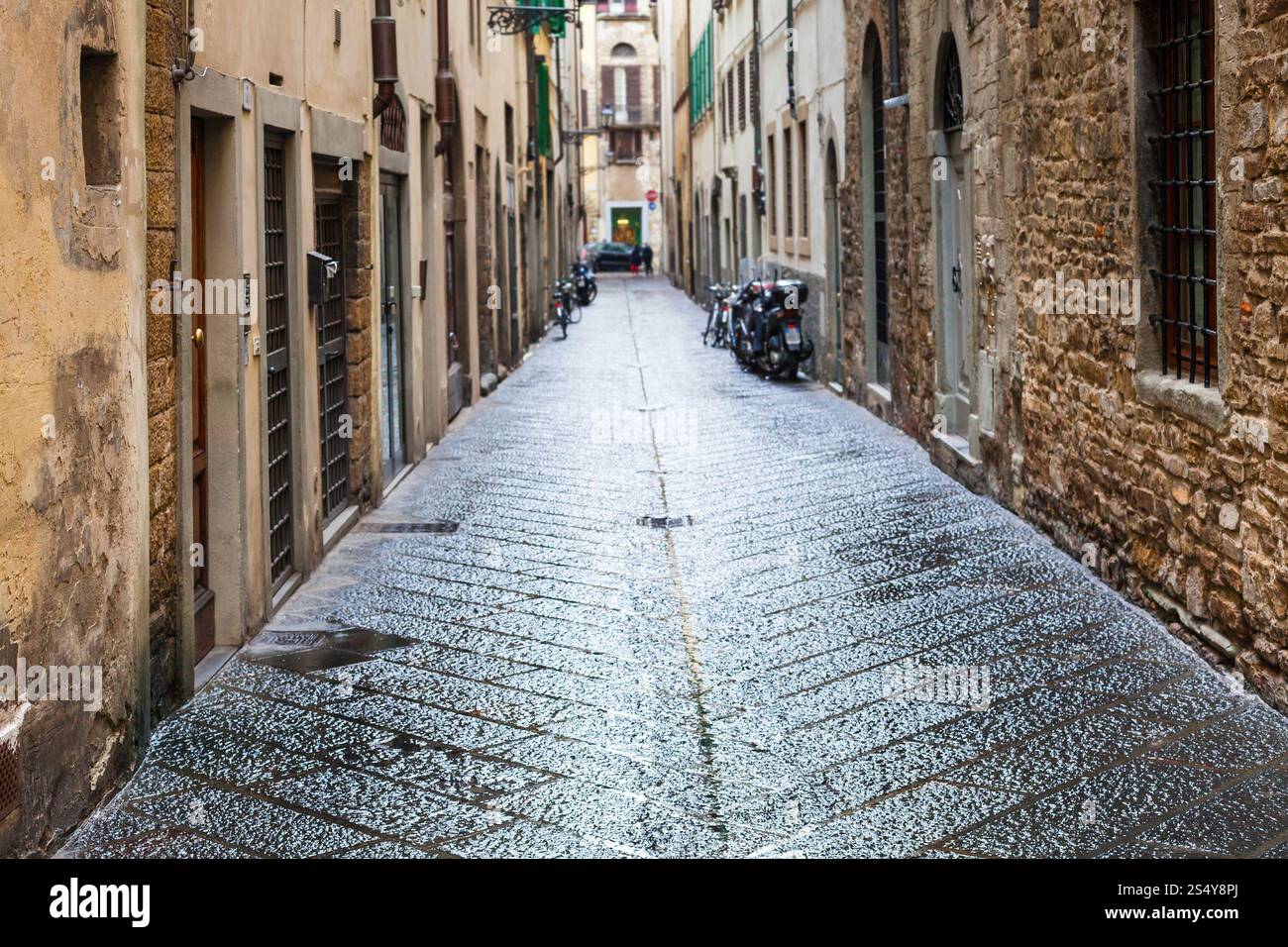 travel to Italy - wet street in old residential district of Florence city in autumn rain Stock Photo