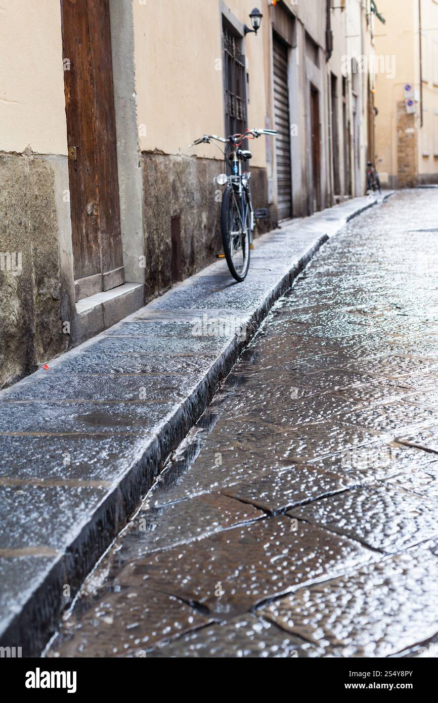 travel to Italy - wet street in Florence city in autumn rain Stock Photo