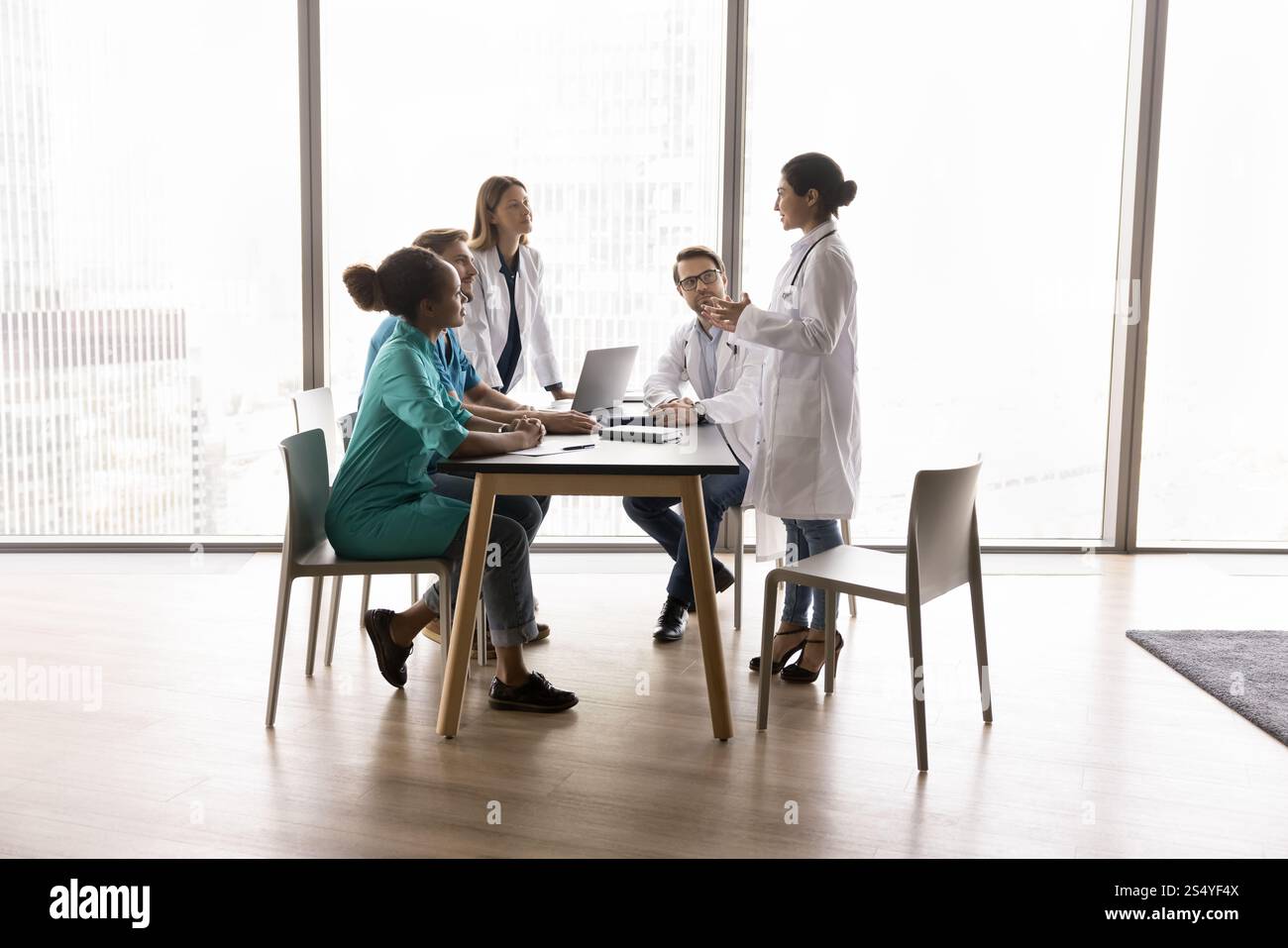 Young Indian female doctor performs, make speech during concilium Stock Photo