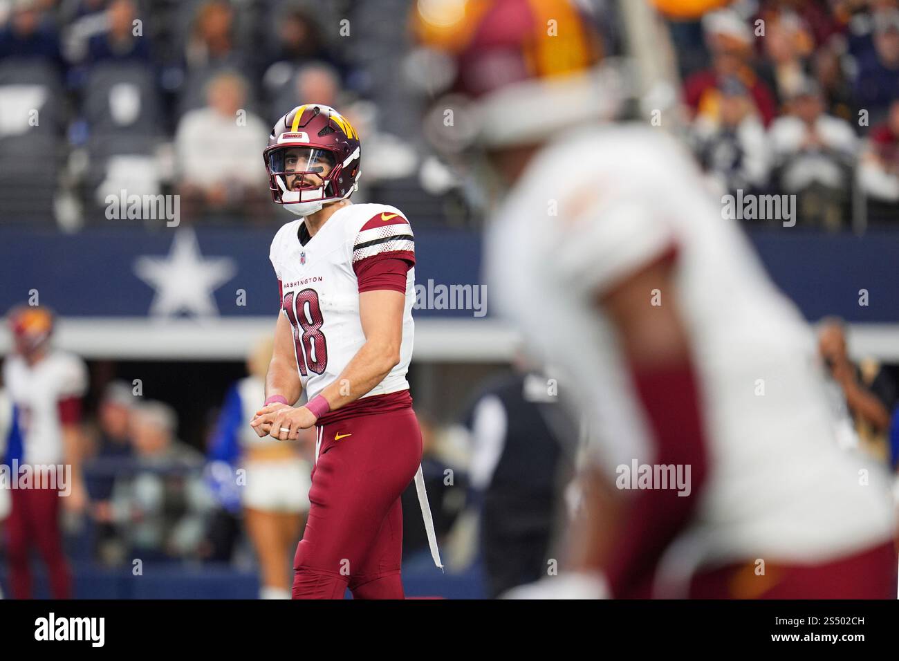 Washington Commanders quarterback Marcus Mariota (18) looks to ...