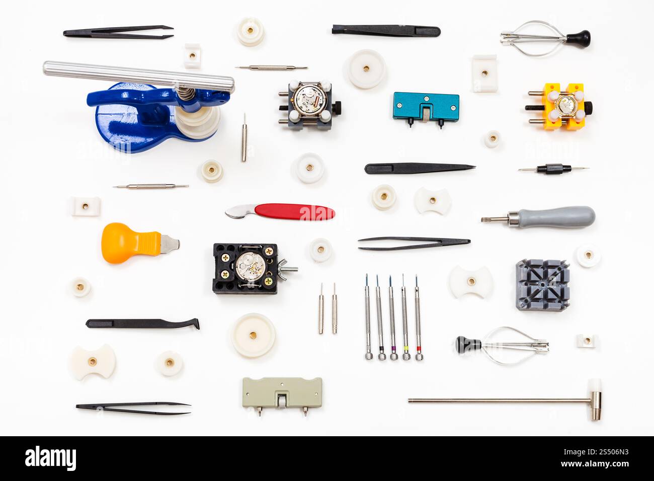 watchmaker workshop - pattern from various watch repairing tools on white background Stock Photo