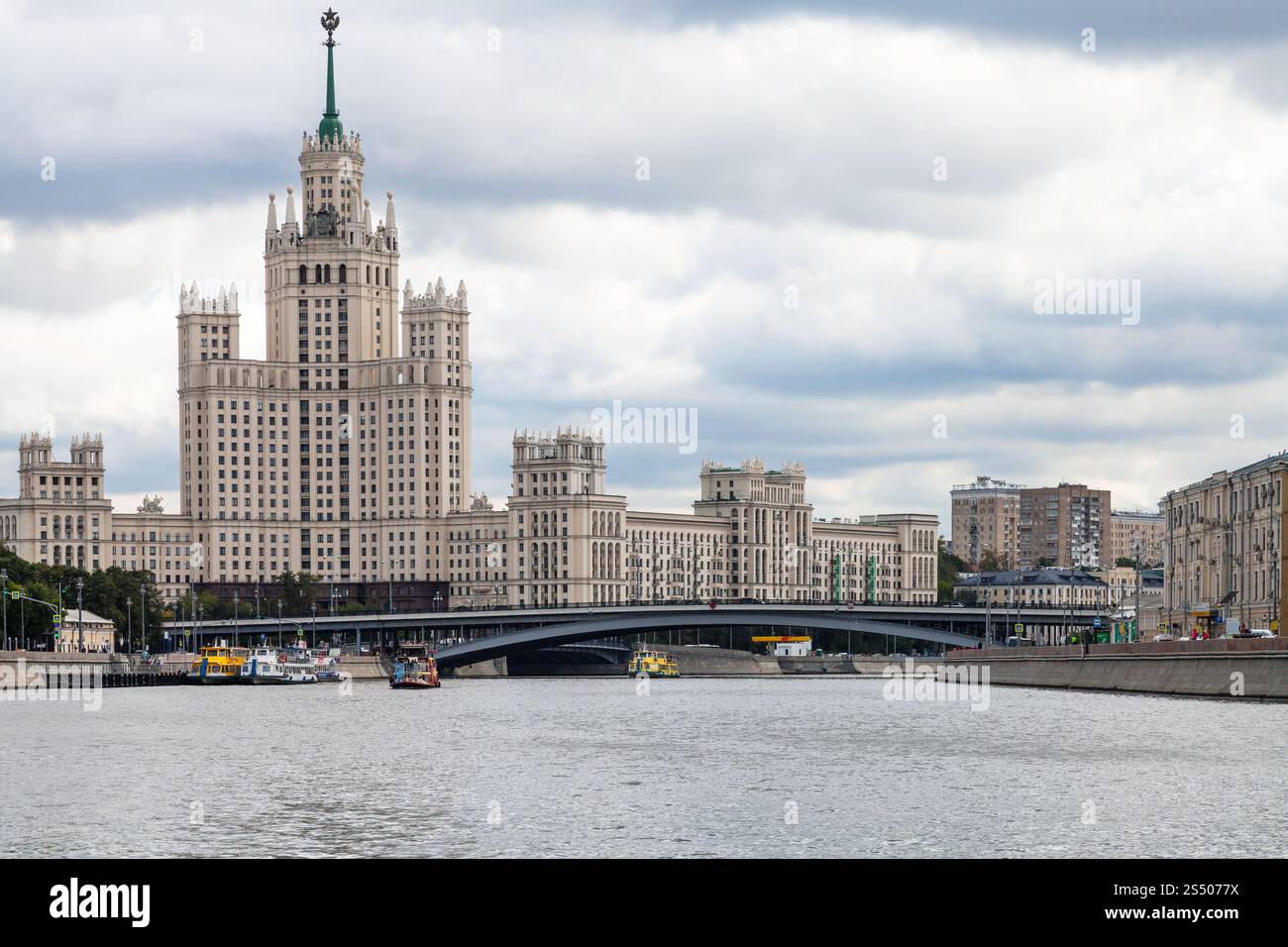 view of Kotelnicheskaya Embankment High-Rise Building and Bolshoy Ustinsky Bridge of Moskva River in Moscow city in autumn Stock Photo