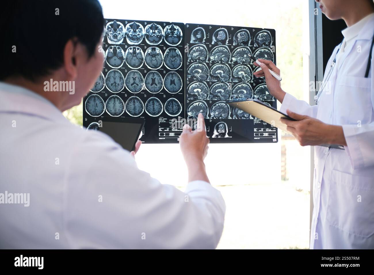 Education profession people and medicine concept close up of happy doctors with tablet and papers at seminar or hospital Stock Photo