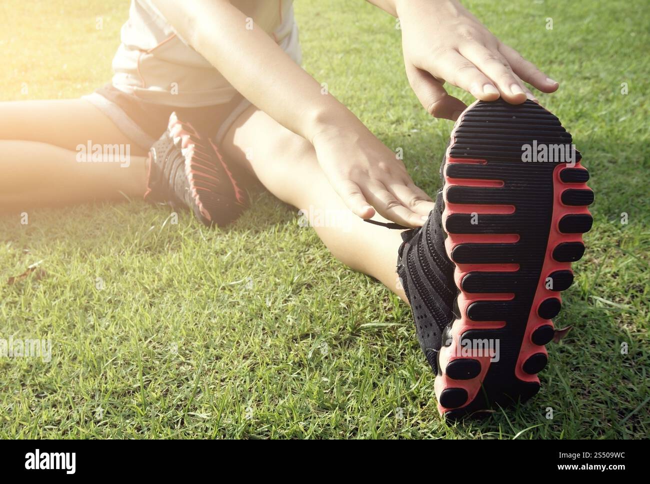 Attractive Women warm up stretching exercise their legs before workout Stock Photo