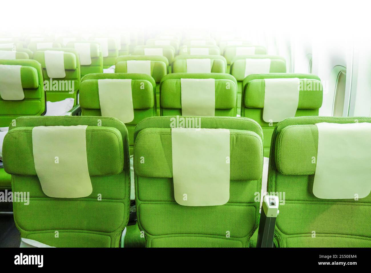 Green Airplane seats in cabin. Interior view. Airplane seats in cabin Stock Photo