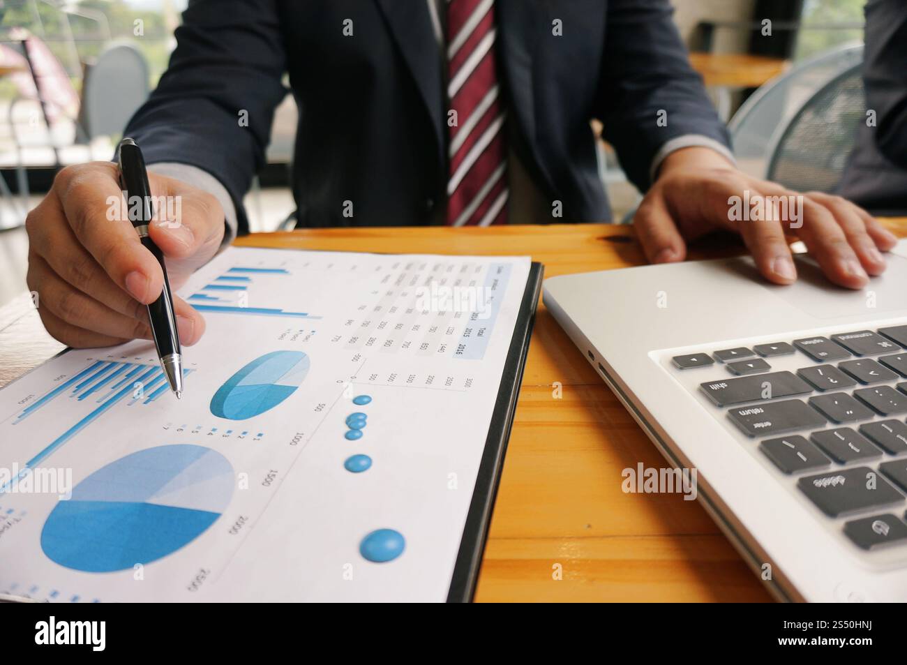 Hands of business people analyzing chart Finance managers task. Stock Photo