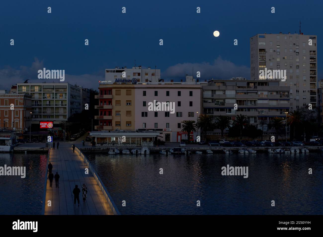 First full moon of 2025 also known as Wolf moon rises over city on