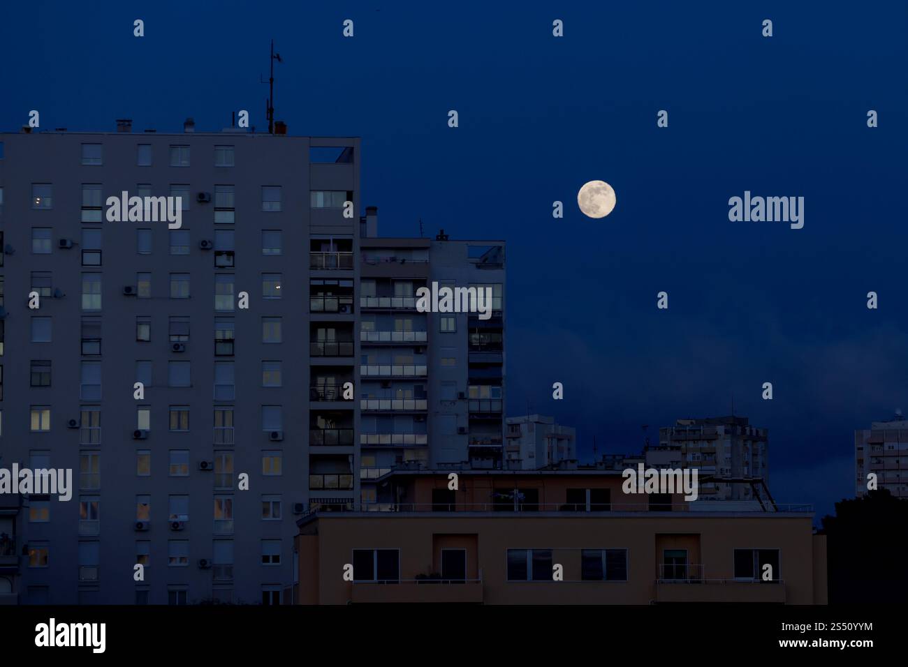 First full moon of 2025 also known as Wolf moon rises over city on