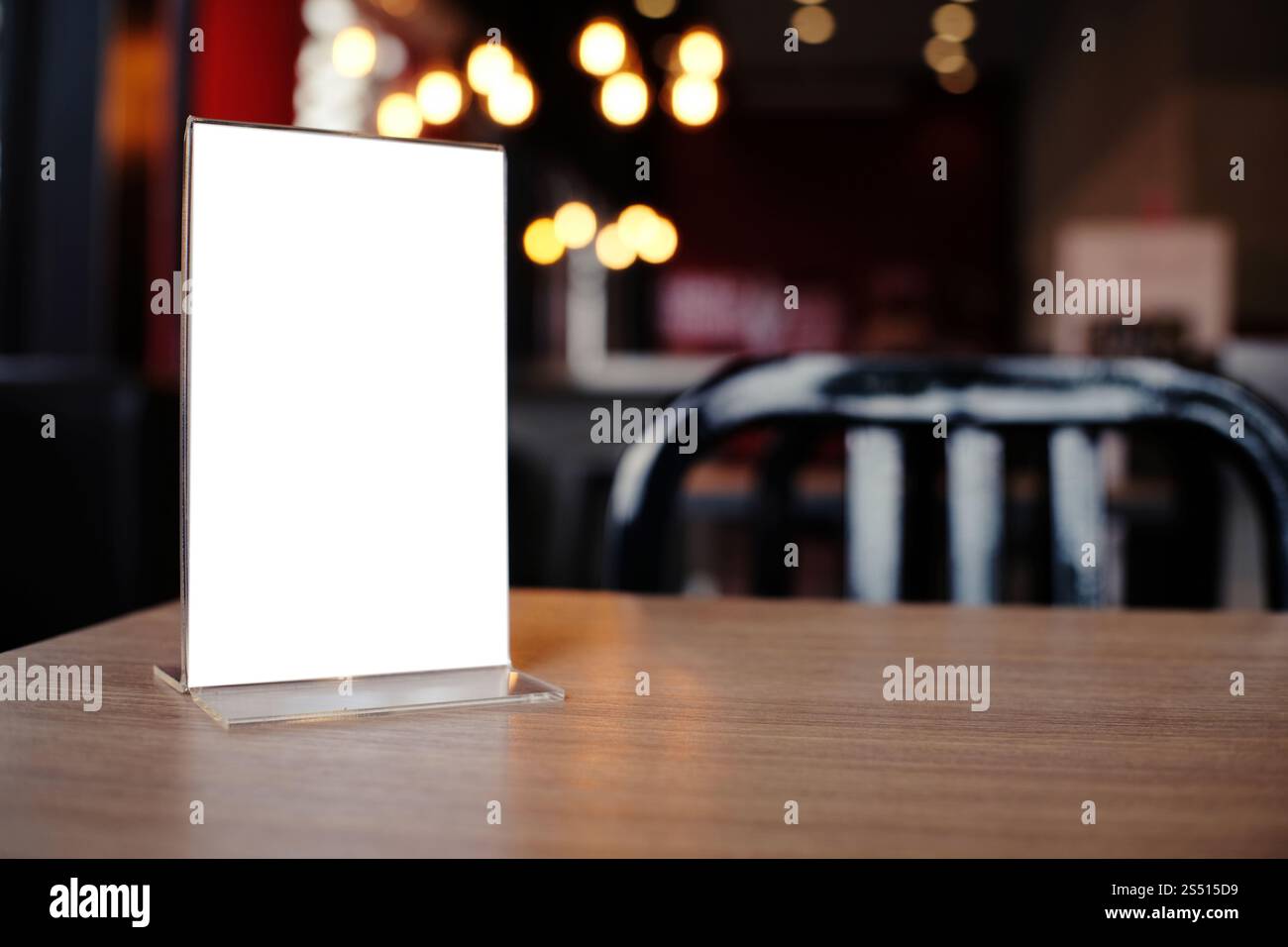 Mock up Menu frame standing on wood table in Bar restaurant cafe. space ...