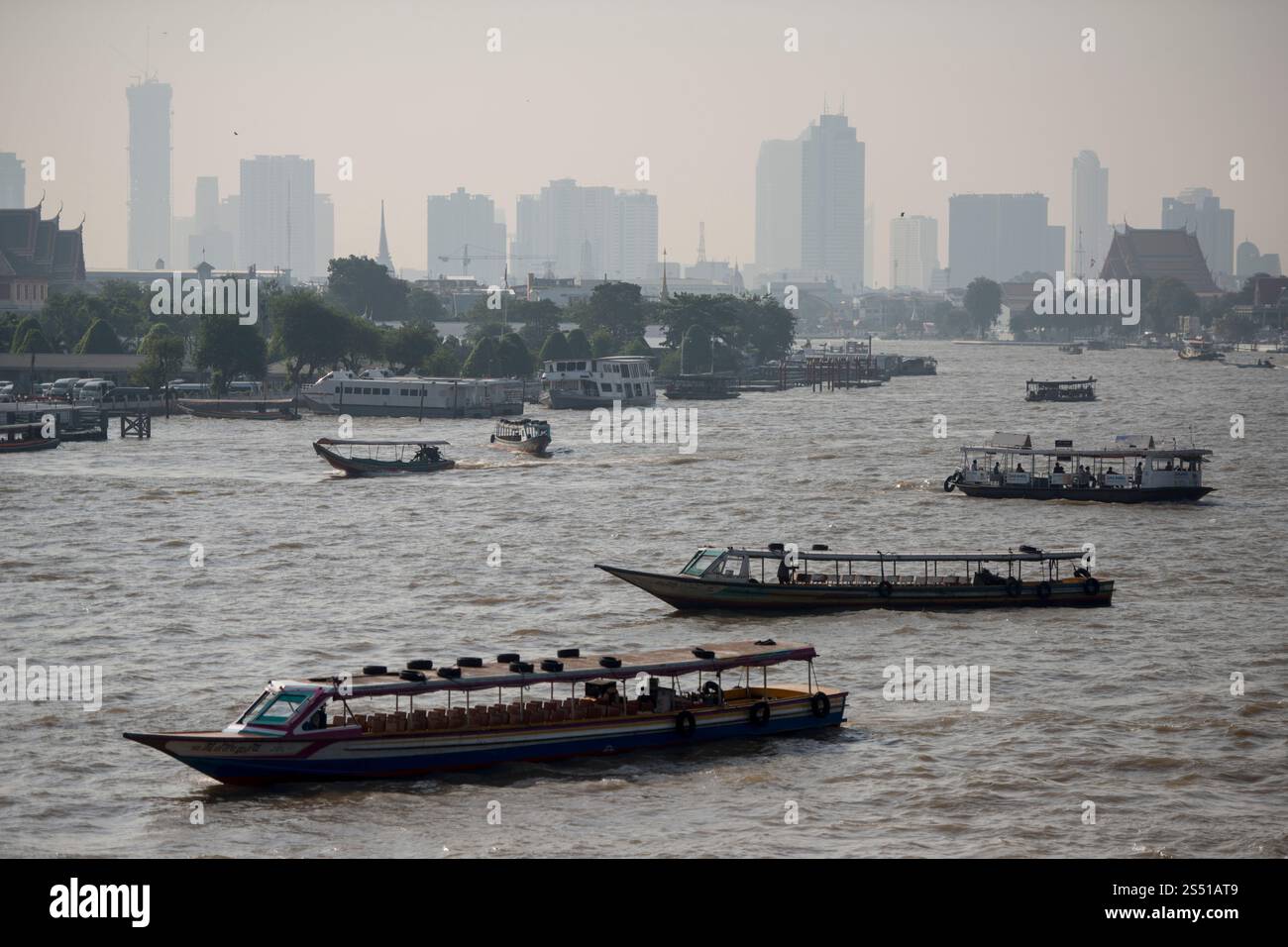 Boat trafic at the chao phraya river in the city of Bangkok in Thailand ...