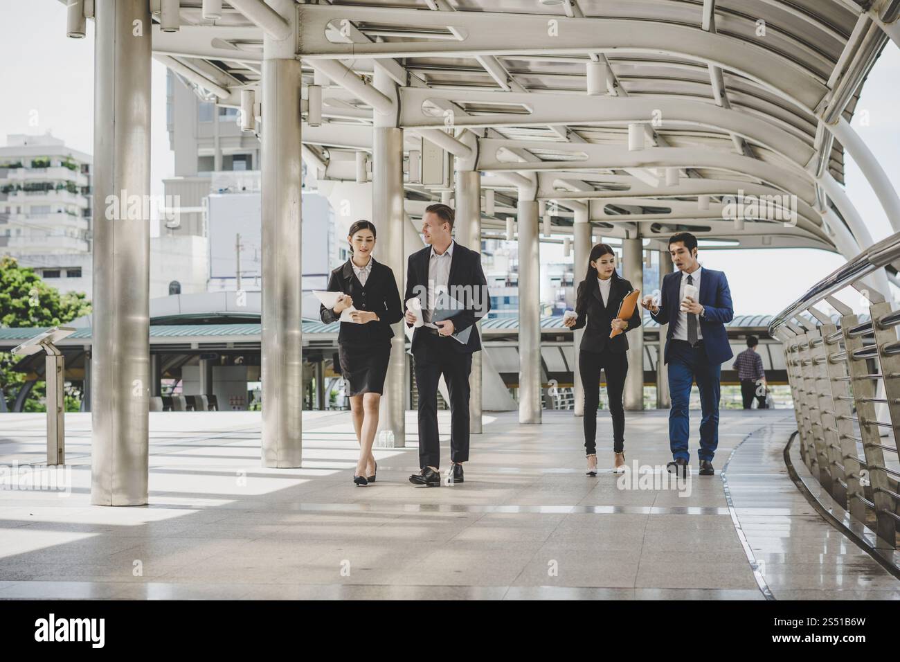 Business people walking hi-res stock photography and images - Alamy