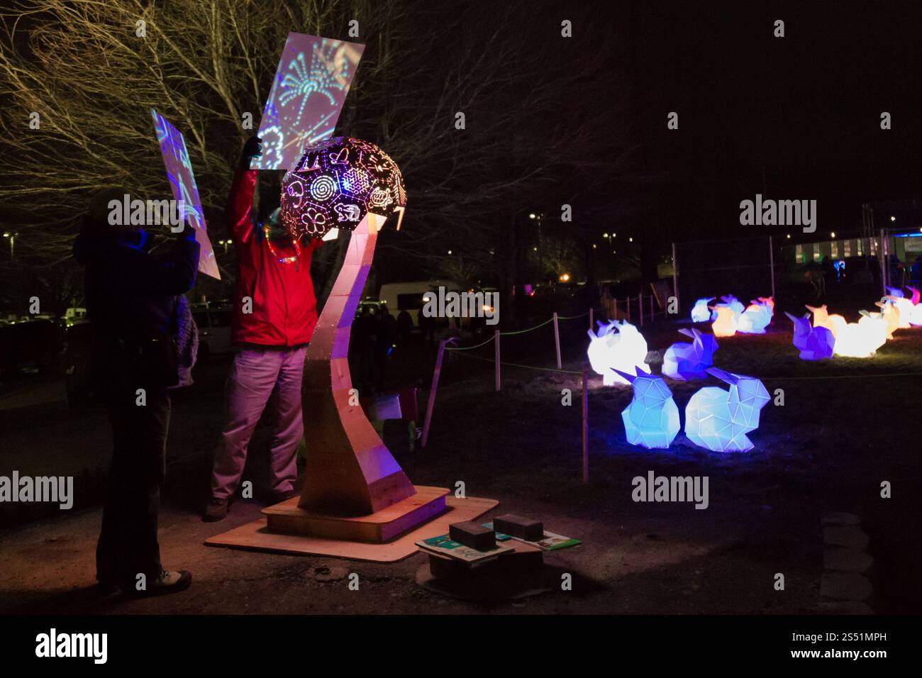 Colorful Outdoor Illuminations Display Featuring Abstract Artwork and Glowing Bunny Sculptures, Winter Light Festival, Portland, Oregon Stock Photo