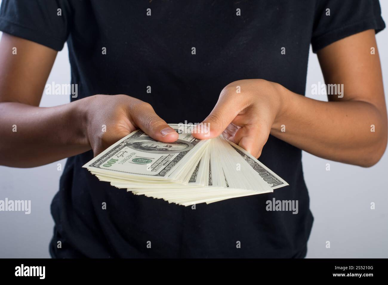 Close up of Woman hand holding with money isolated on white back. Close ...