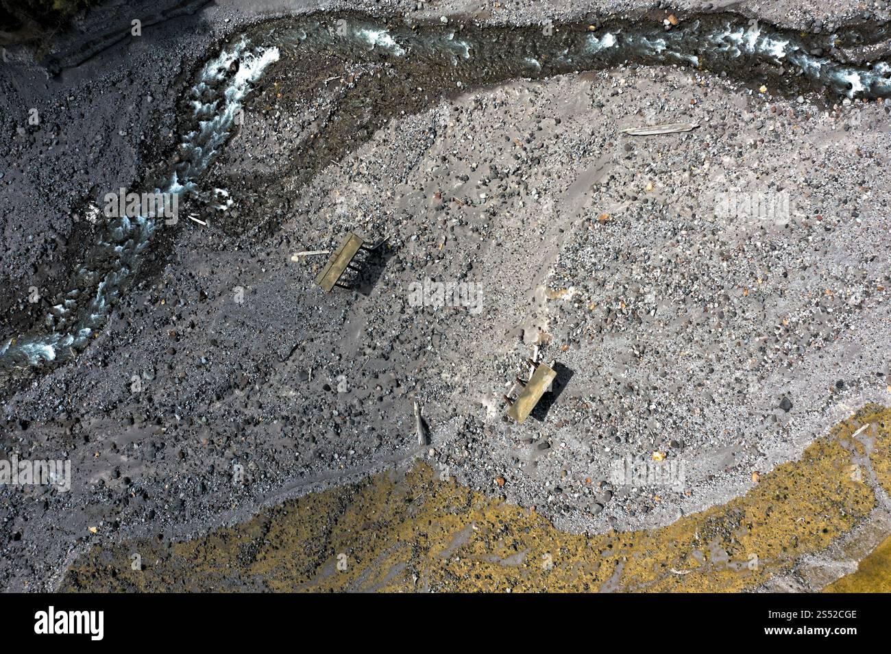 Aerial View of meandering Stream and Rocky Terrain With Ruins in Remote Valley, Gifford Pinchot National Forest, Washington Stock Photo