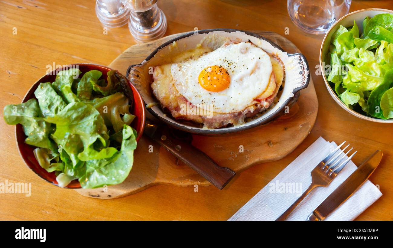 Swiss cheese crust with fried egg Stock Photo