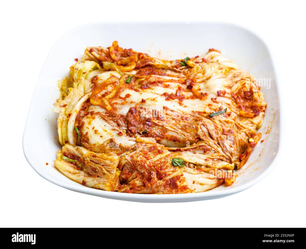 korean cuisine - kimchi appetizer (spice nappa cabbage) in white bowl isolated on white background Stock Photo