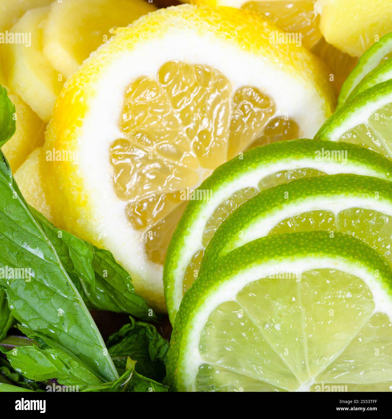 food background - cocktail ingredients, slices of fresh limes, lemons ...