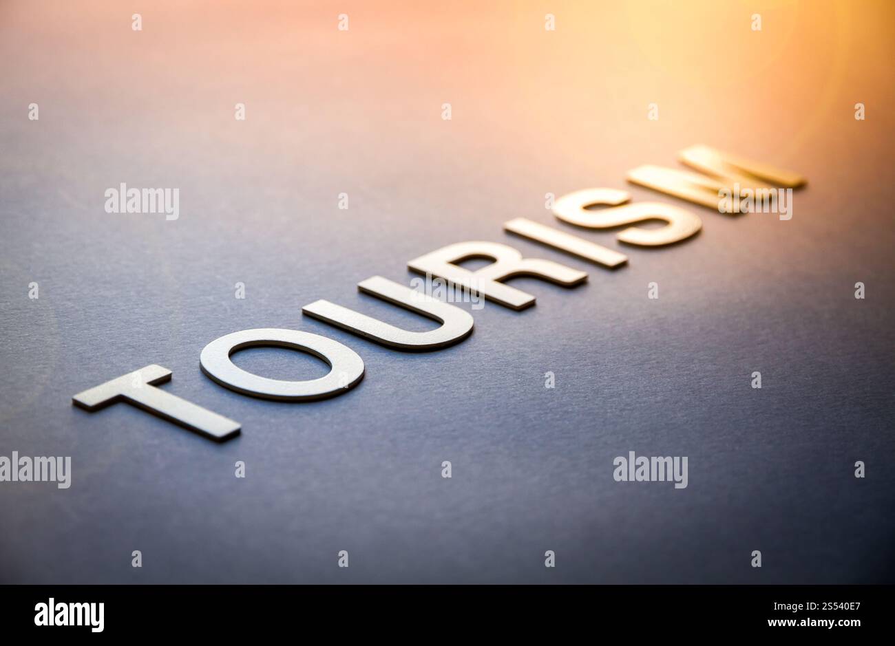 Word tourism written with white solid letters on a board. Word tourism written with white solid letters Stock Photo