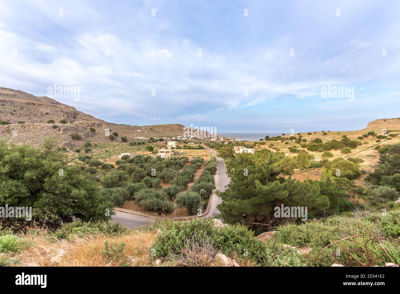 A landscape view of the Greek island of Rhodes. Showing the trees, mountains and then the sea in the background. Stock Photo