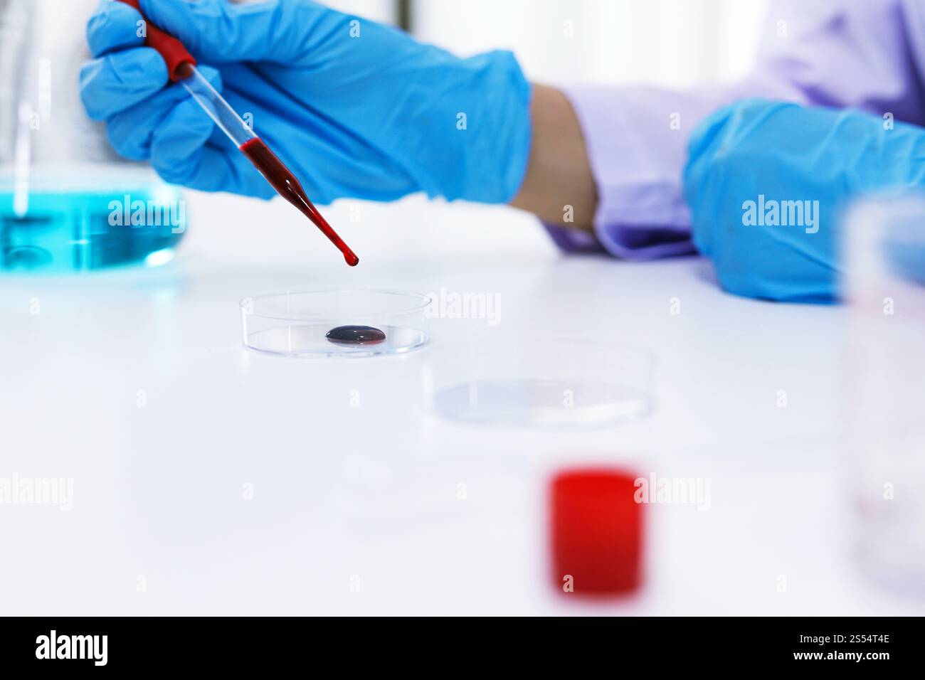 Scientist holding Coronavirus covid-19 infected blood sample tube. DNA ...