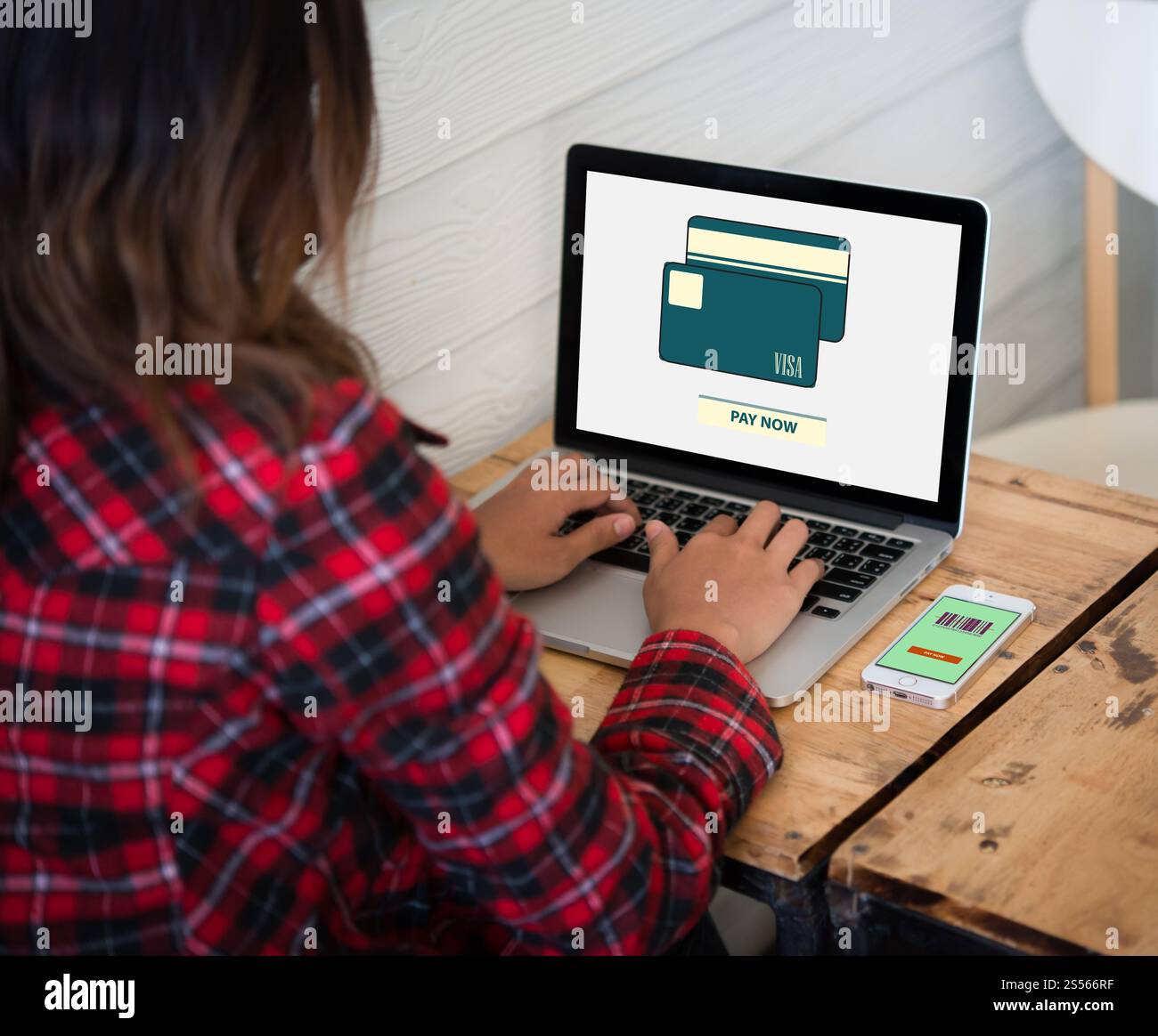 Online purchase credit card on laptop screen with woman hands typing. Stock Photo
