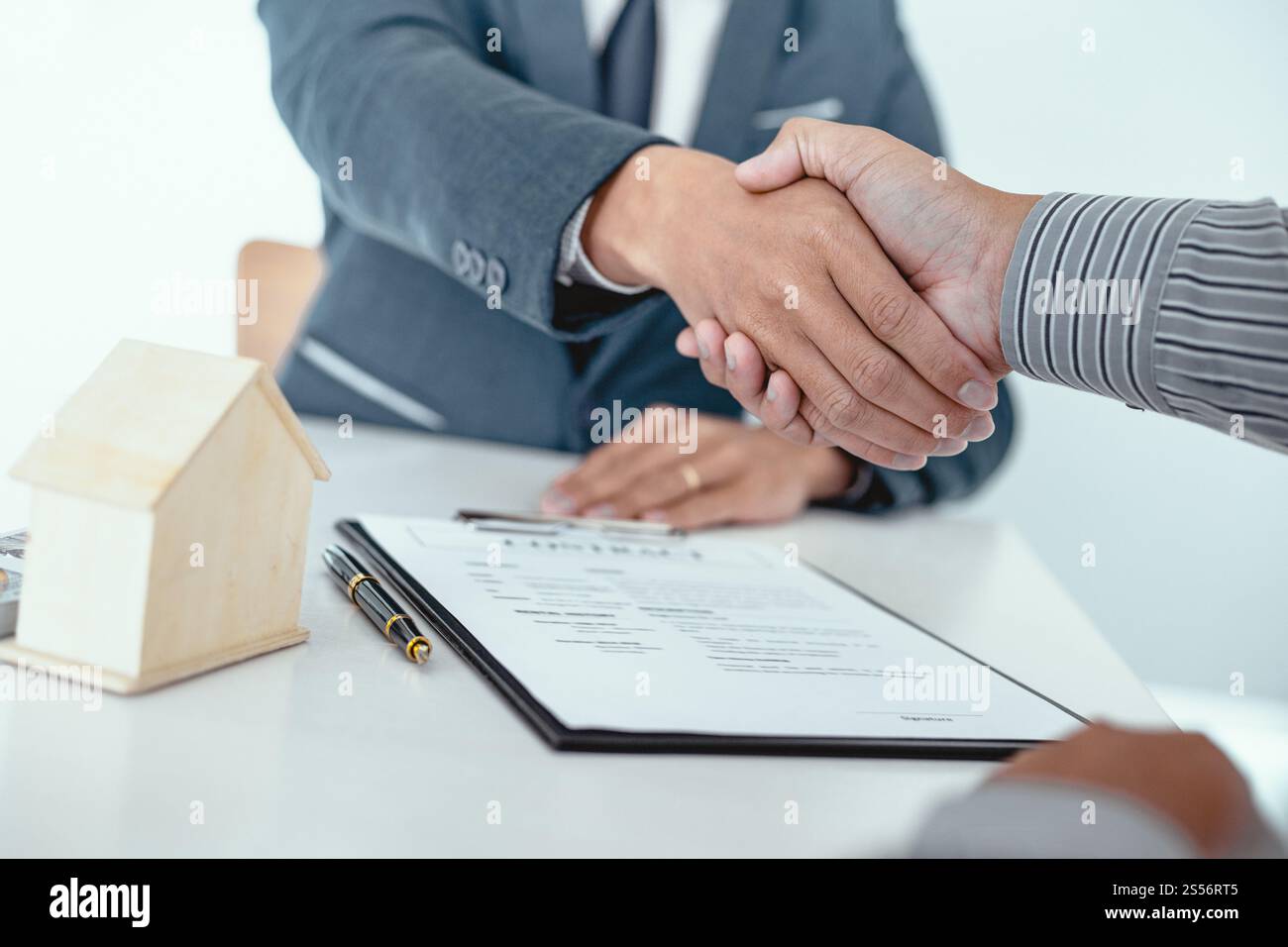 Real estate agent handshake. Business partnership meeting concept. and ...