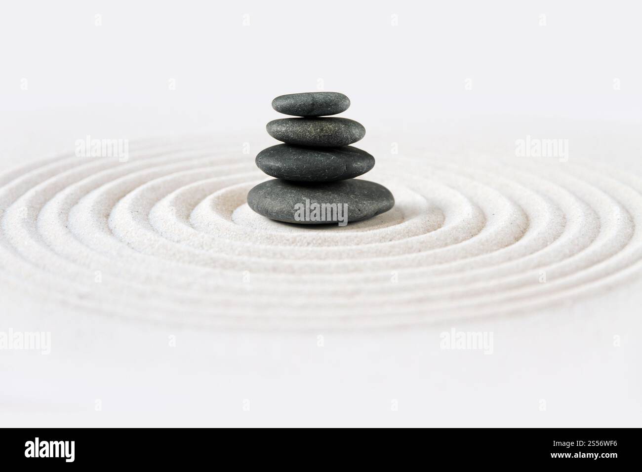 Black stones pile in the sand. Zen japanese garden background scene ...