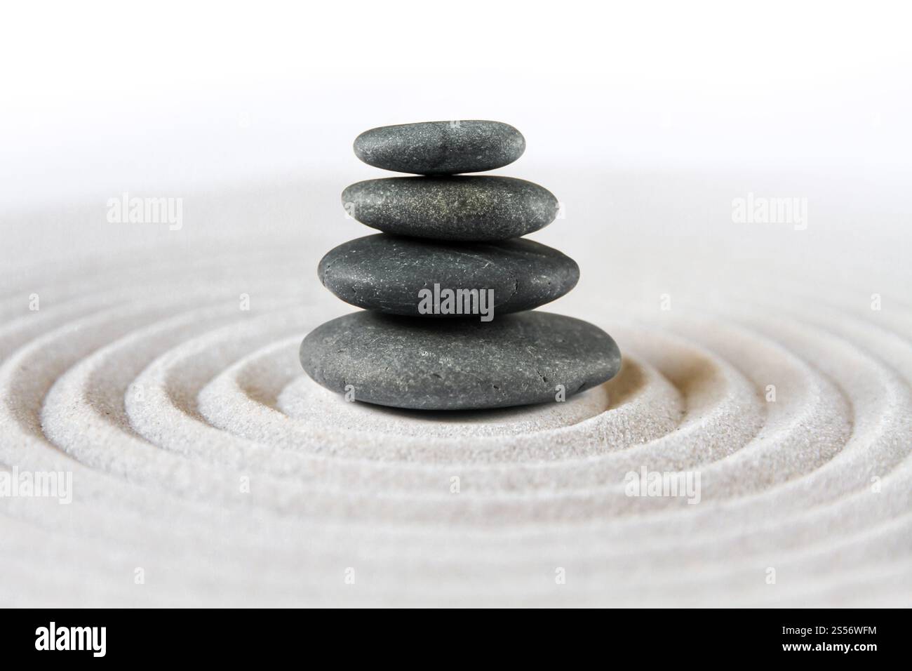Black stones pile in the sand. Zen japanese garden background scene ...